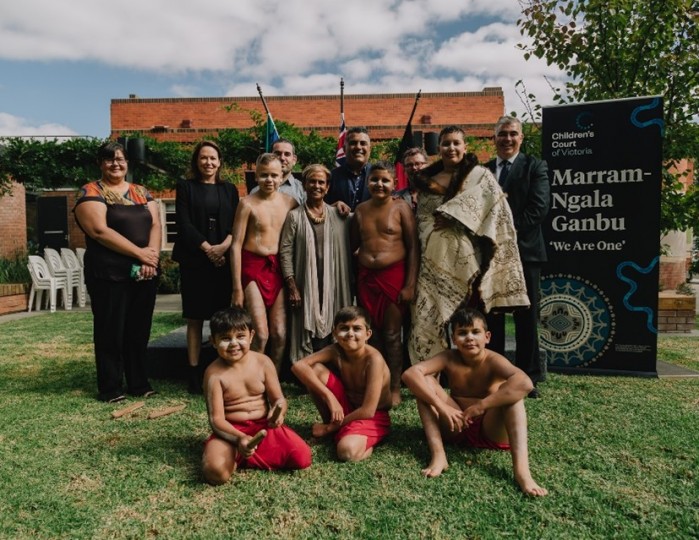 A group of Koori adults and children outside at the program launch